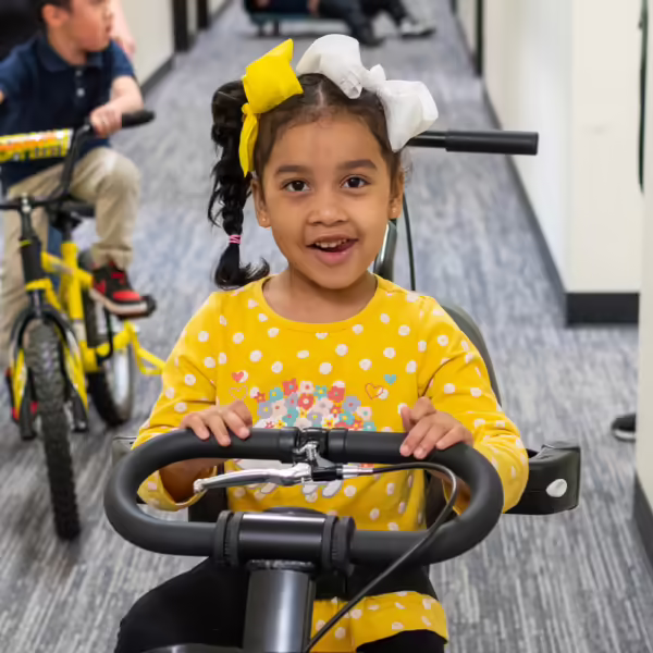 girl on bike smiling